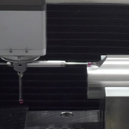 CMM probe measuring a machined part